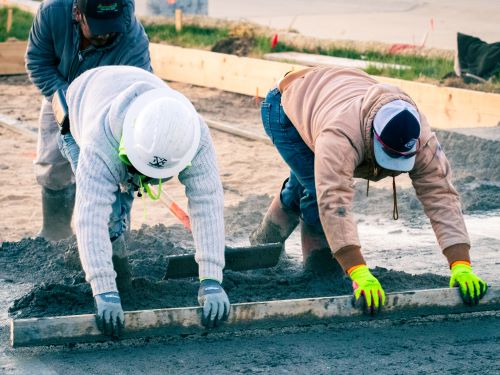 Two Men Leveling Concrete