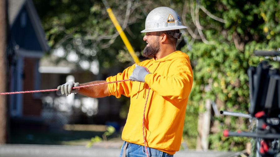 Crew member smoothing by pullin